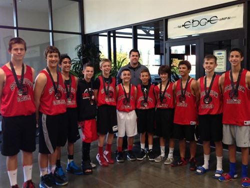 Student athletes posing for group photo wearing medals